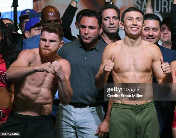 Boxer Canelo Alvarez and WBC, WBA and IBF middleweight champion Gennady Golovkin pose during their official weigh-in at MGM Grand Garden Arena on...