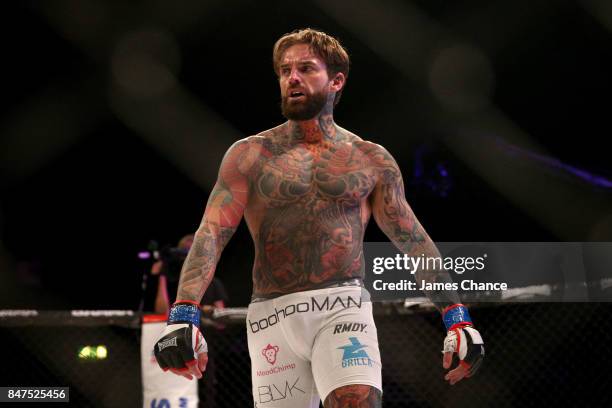 Aaron Chalmers of England celebrates victory after his Welterweight fight against Alex Thompson of England during BAMMA 31 at SSE Arena Wembley on...