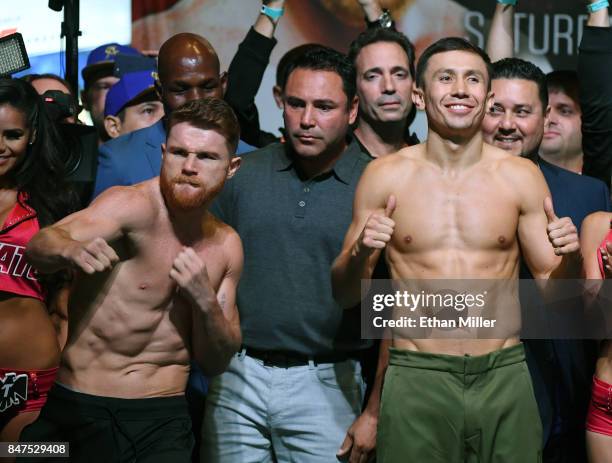 Golden Boy Promotions Chairman and CEO Oscar De La Hoya looks on as Boxer Canelo Alvarez and WBC, WBA and IBF middleweight champion Gennady Golovkin...