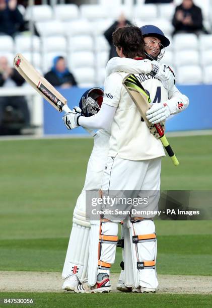 Essex's Billy Godleman celebrates reaching his century with team-mate James Foster during the LV County Championship Division Two Match at the Ford...