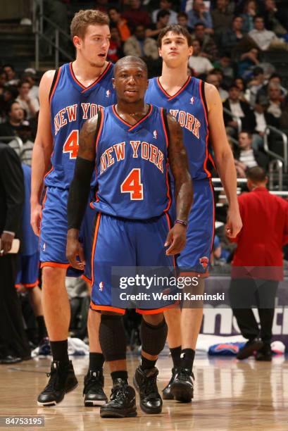 David Lee, Nate Robinson, and Danilo Gallinari of the New York Knicks look on during their game against the Los Angeles Clippers at Staples Center on...