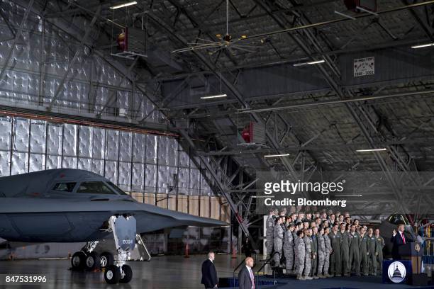 President Donald Trump, bottom right, delivers remarks to military personnel and families in an aircraft hangar at Joint Base Andrews, Maryland,...