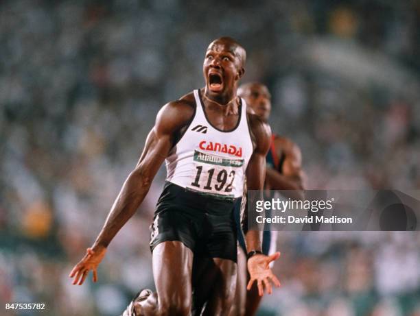 Donovan Bailey of Canada celebrates winning the 100 meter race of the 1996 Summer Olympics on July 27, 1996 in the Centennial Olympic Stadium in...