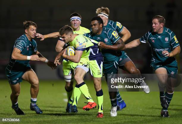 Will Cliff of Sale Sharks is tackled by Napolioni Nalaga of London Irish during the Aviva Premiership match between Sale Sharks and London Irish at...