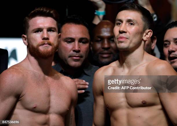 Boxers Canelo Alvarez and Gennady Golovkin pose during their weigh-in at the MGM Grand Hotel & Casino on September 15, 2017 in Las Vegas, Nevada....