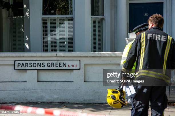 Police officers and firefighter at Parsons Green. Several people have been injured after an explosion on a tube train in south-west London. The...