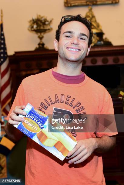 Actor Troy Gentile poses with a box of TasyKake Krimpets during an event honoring Producer Alan F. Goldberg at Philadelphia City Hall on September...