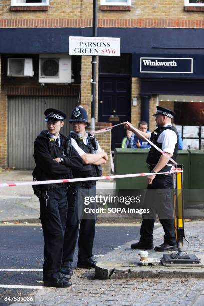 Policemen stands around the Parsons Green Underground Station. Several injured at Parsons Green as passengers report seeing device on District Line...