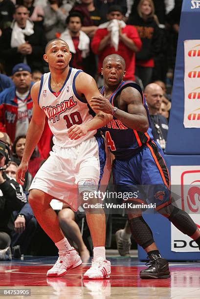 Eric Gordon of the Los Angeles Clippers is guarded by Nate Robinson of the New York Knicks during their game at Staples Center on February 11, 2009...