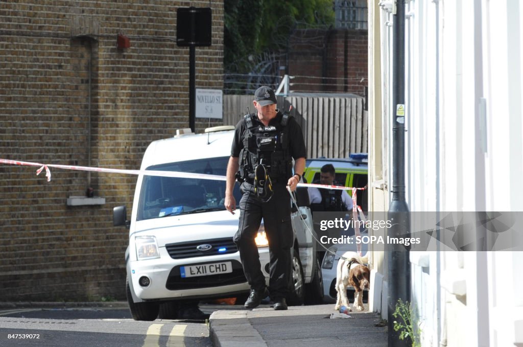 A policeman with his dog is seen around the Parsons Green...