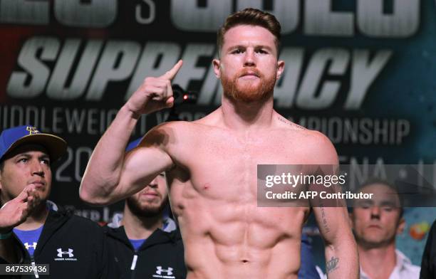 Boxer Canelo Alvarez poses on the scales during a weigh-in with Gennady Golovkin at the MGM Grand Hotel & Casino on September 15, 2017 in Las Vegas,...