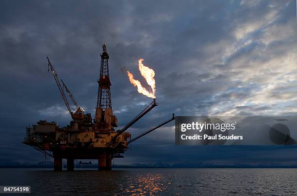 offshore oil rig, cook inlet, alaska - 燃焼煙突 ストックフォトと画像