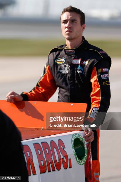 Kevin Donahue, driver of the Mittler Bros. Machine & Tool Chevrolet, stands on the grid during qualifying for the NASCAR Camping World Truck Series...