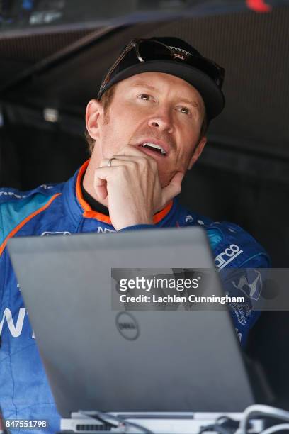 Scott Dixon of New Zealand driver of the NTT Data Honda talks to his crew during practice on day 1 of the GoPro Grand Prix of Sonoma at Sonoma...