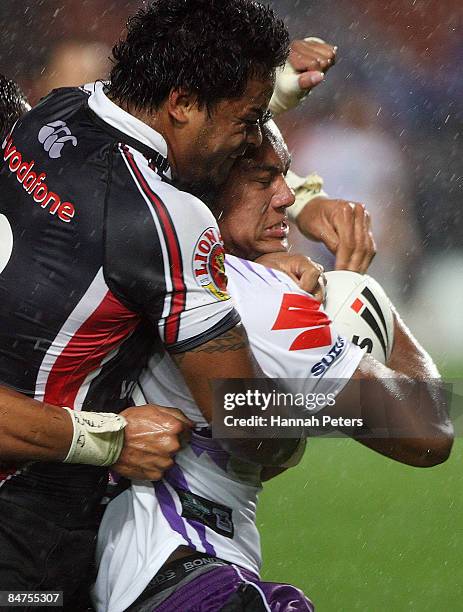Andre Itula of the Storm is hit hard by Epalahame Lauaki of the Warriors during the NRL Trial match between the Warriors and the Melbourne Storm at...