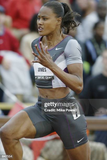 Marion Jones competes in the women's 100 meter dash during the 2002 USA Outdoor Track & Field Championships on June 21, 2002 at Stanford University...