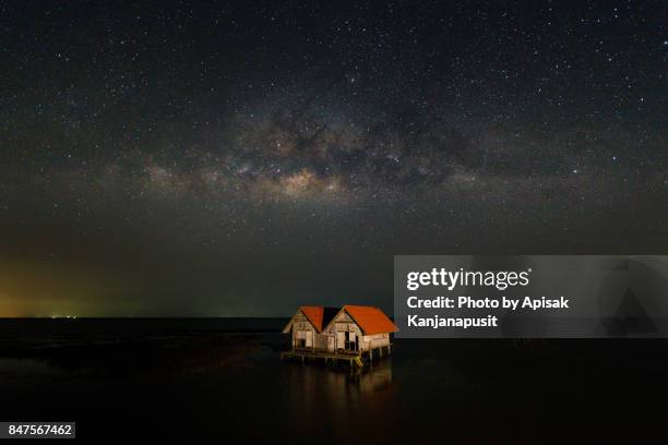 abandoned house with milky way in thale noi lake at phatthalung province, thailand. - phatthalung province stock-fotos und bilder
