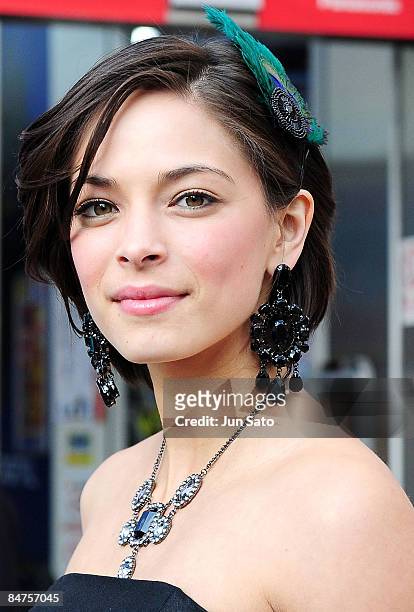 Actress Kristin Kreuk poses for photographers at Akihabara shopping street on February 12, 2009 in Tokyo, Japan. Kreuk is in Tokyo to promote her...