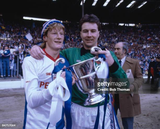 Blackburn Rovers goalscorer Colin Hendry with goalkeeper Vince O'Keefe and the Full Members Cup on their lap of honour after victory over Charlton...