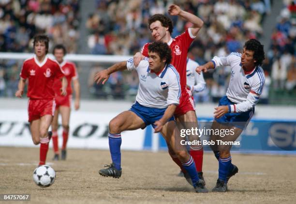 Nottingham Forest's Martin O'Neill battles with Nacional's Denis Milar and Victor Esparrago in midfield during the World Club Championship match in...