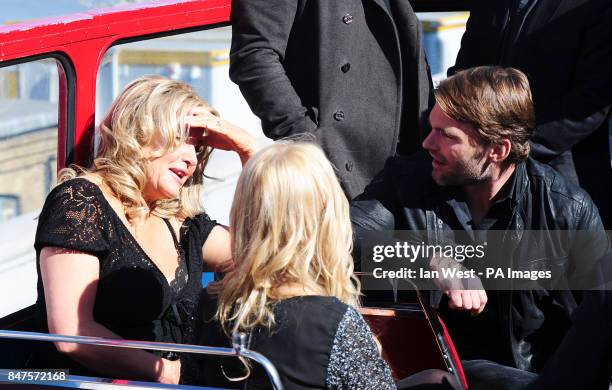 Jennifer Coolidge and Sean William Scott while on an open top bus in London to promote their new film, American Pie:Reunion.