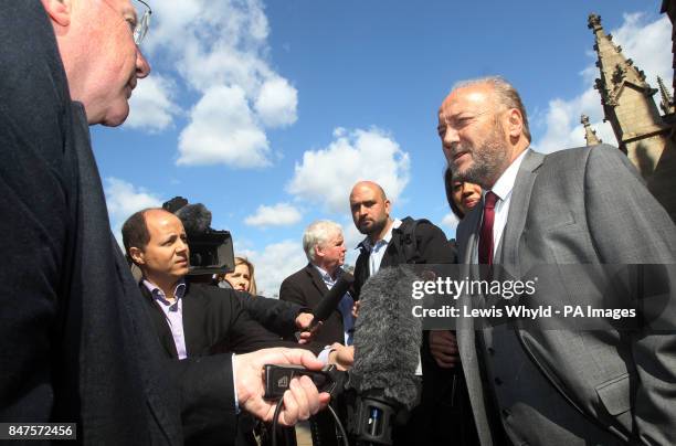 Bradford West MP George Galloway talks to the media in front of the Houses of Parliament before being sworn in as an MP later today.