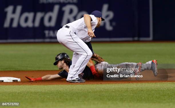 Second baseman Danny Espinosa of the Tampa Bay Rays catches Andrew Benintendi of the Boston Red Sox attempting to steal second base during the first...