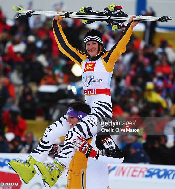 Race winner Kathrin Hoelzl of Germany is lifted high on the shoulders of team mate Maria Riesch after victory during the Women's Giant Slalom event...