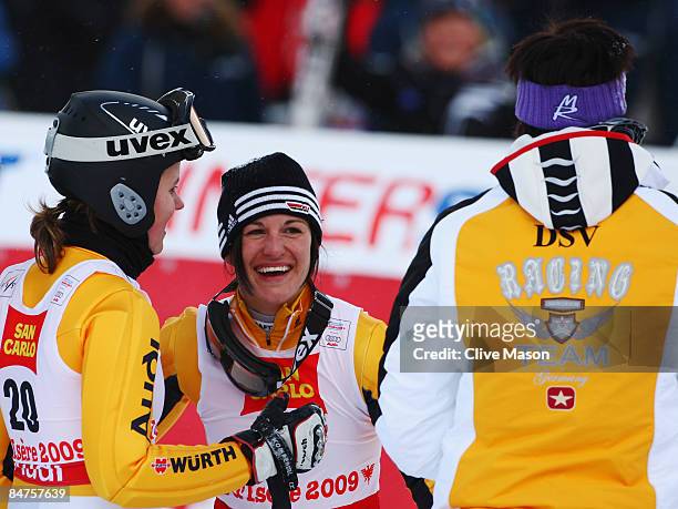 Race winner Kathrin Hoelzl of Germany celebrates with team mates Viktoria Rebensburg and Maria Riesch after victory during the Women's Giant Slalom...