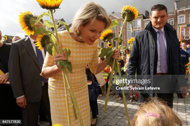 Queen Mathilde Of Belgium is welcomed by children of the city welcome with sunflowers after visiting the Eurofleurs 2017 Championship on September...