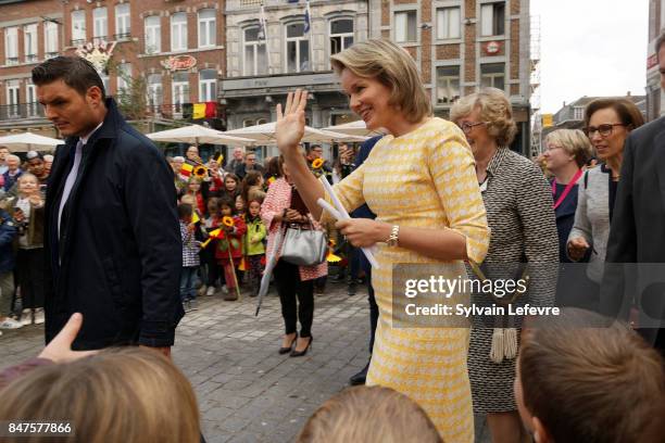 Queen Mathilde Of Belgium waves as she arrives on main square after visiting the Eurofleurs 2017 Championship on September 15, 2017 in Saint-Trond,...