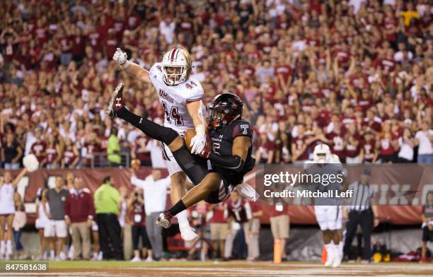 Keith Kirkwood of the Temple Owls catches a touchdown pass against Bryton Barr of the Massachusetts Minutemen in the second quarter at Lincoln...