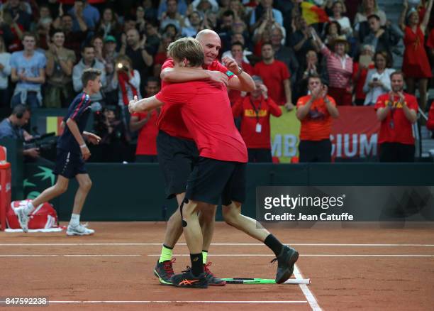 Captain of Belgium Johan van Herck greets David Goffin after his victory over John Millman of Australia during day one of the Davis Cup World Group...