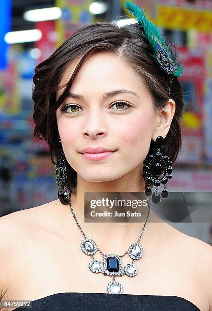 Actress Kristin Kreuk poses for photographers at Akihabara shopping street on February 12, 2009 in Tokyo, Japan. Kreuk is in Tokyo to promote her...