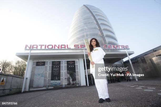 Jasmine Vanmali carries the torch from the National Space Centre during the dress rehearsal for the London 2012 Olympic Torch Relay.