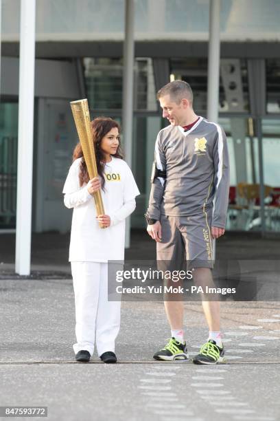 Jasmine Vanmali with an unidentifiedcarries the torch from the National Space Centre during the dress rehearsal for the London 2012 Olympic Torch...