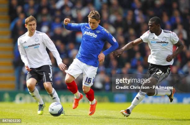 Portsmouth's Scott Allan in action against Derby County's Theo Robinson and Jason Shackell during the npower Championship match at Fratton Park,...