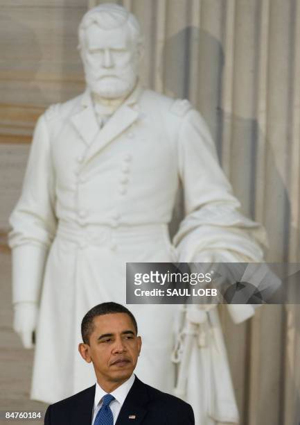 President Barack Obama stands in front of a statue of former US President Ulysses S. Grant during the Lincoln Bicentennial Celebration in the Rotunda...