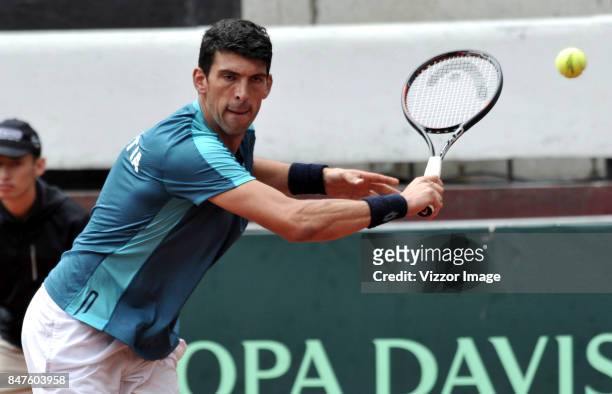 Franko Skugor of Croatia plays a backhand during a match against Santiago Giraldo of Colombia as part of Davis Cup at La Santamaria Ring Bull on...