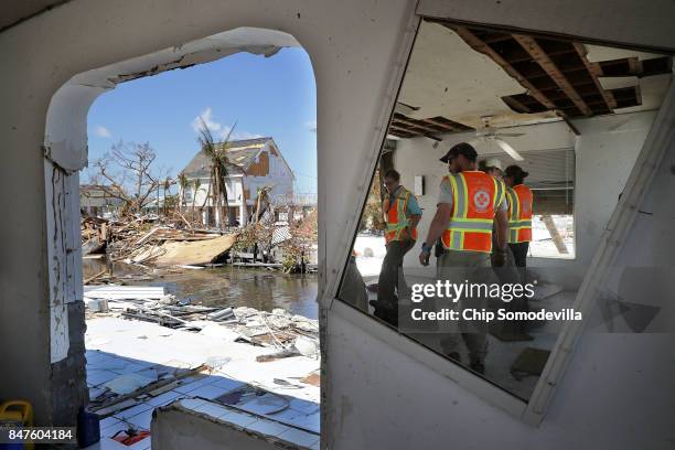 Rescue nurses and volunteers from What's Next Adventures search for people in a waterfront neighborhood hard hit by Hurricane Irma September 15, 2017...