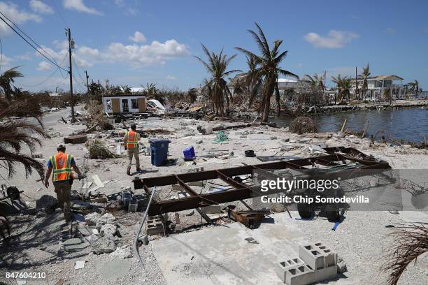 Rescue volunteers Ian Beaumont and Sam Kichline search for people in a waterfront neighborhood hard hit by Hurricane Irma September 15, 2017 in...