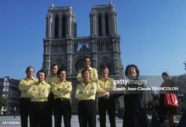 Variety group singers Les Compagnons de la Chanson singing in front of the cathedral Notre-Dame de Paris in October 1975 in Paris, France.