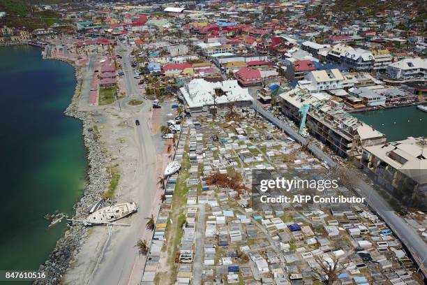 An aerial view shows extensive damage to houses and businesses in St. Martin, Friday, September 15 days after Hurricane Irma struck this Caribbean...