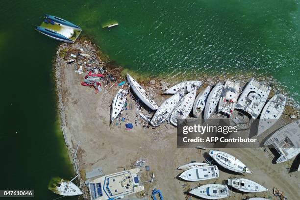 Wrecked boats are seen days after this Caribbean island sustained extensive damage in the wake of Hurricane Irma in St. Martin, Friday, September 15,...