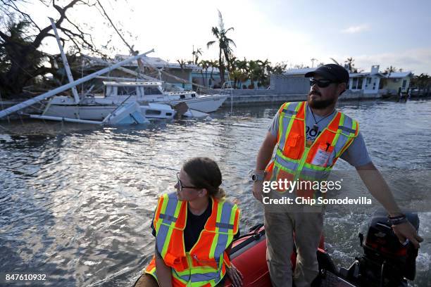 Rescue and aid volunteers Nicole Armstrong and Ian Beaumont from What's Next Adventures look for sunken boats and hand out water and food to...