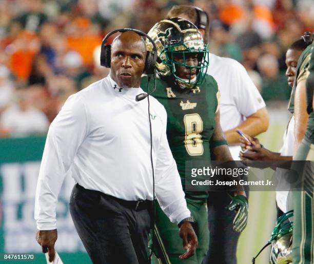 Head coach Charlie Strong of the South Florida Bulls walks on the sidelines during the game against the Illinois Fighting Illini at Raymond James...