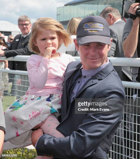Trainer Clint Lundholm with daughter Allie after his horse Larlabrook won the first race during Sydney Racing at Royal Randwick Racecourse on...