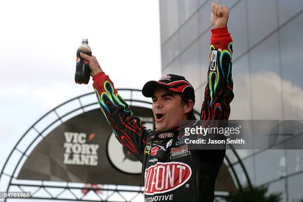 Jeff Gordon, driver of the DuPont Chevrolet, celebrates in victory lane after winning the NASCAR Sprint Cup Series Gatorade Duel 1 at Daytona...
