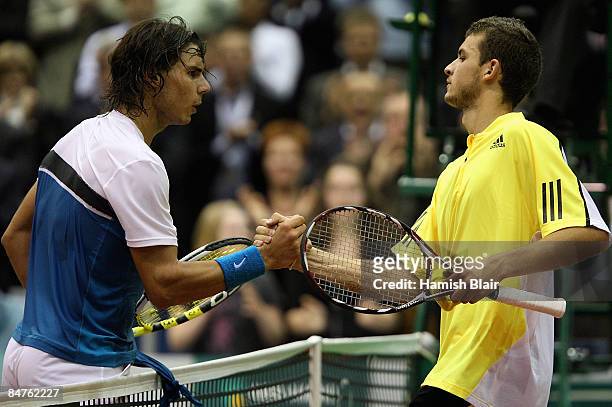 Rafael Nadal of Spain shakes hands with Grigor Dimitrov of Bulgaria after their match during day four of the ABN AMRO World Tennis Tournament at the...