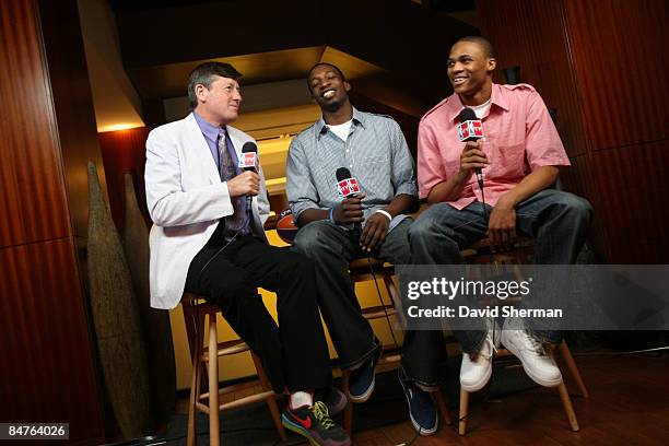 Craig Sager of TNT speaks with Jeff Green and Russell Westbrook of the Oklahoma City Thunder during the All Star Media Availability as part of the...